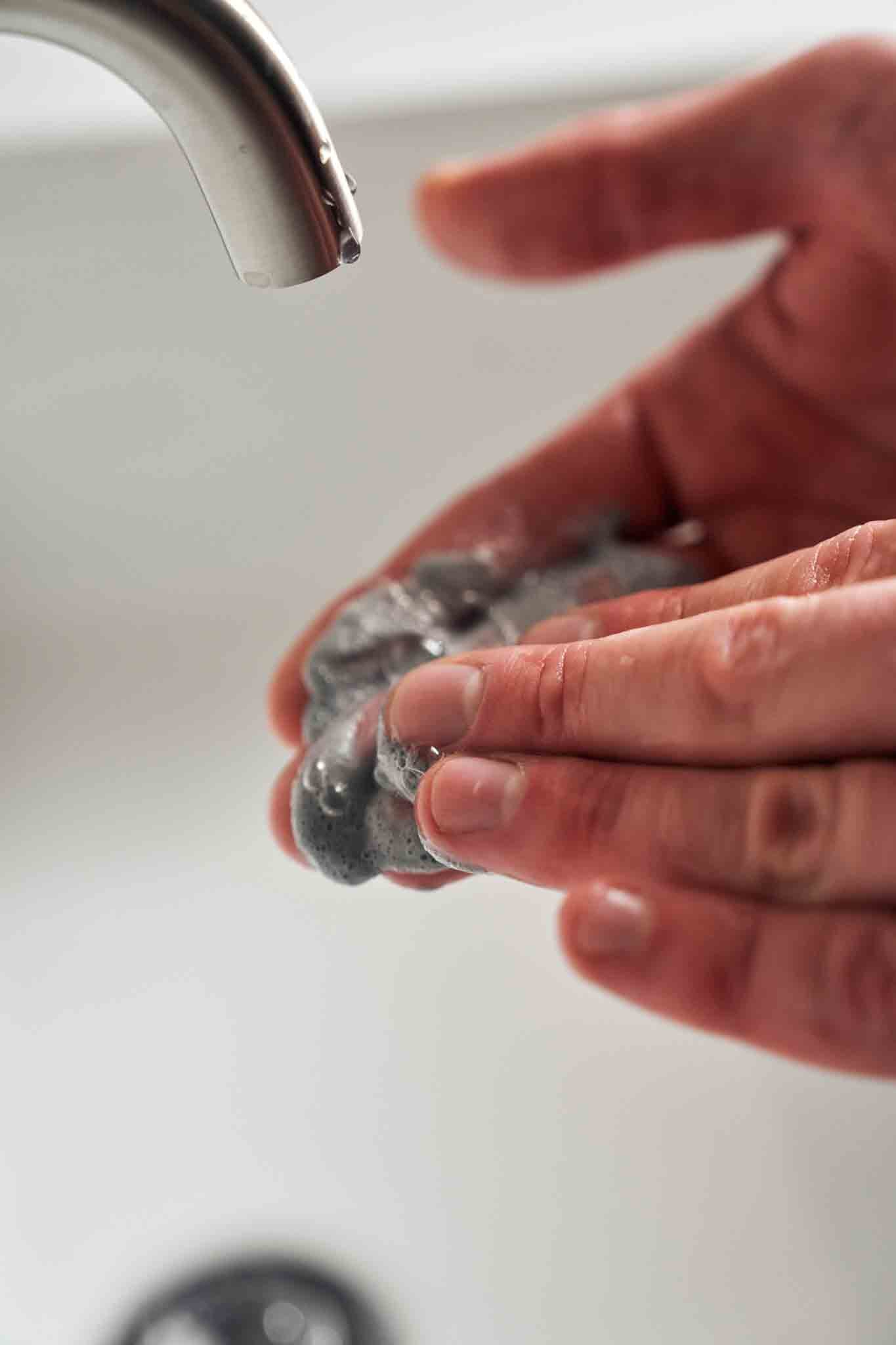 Revate Activate Facial Cleanser on fingers