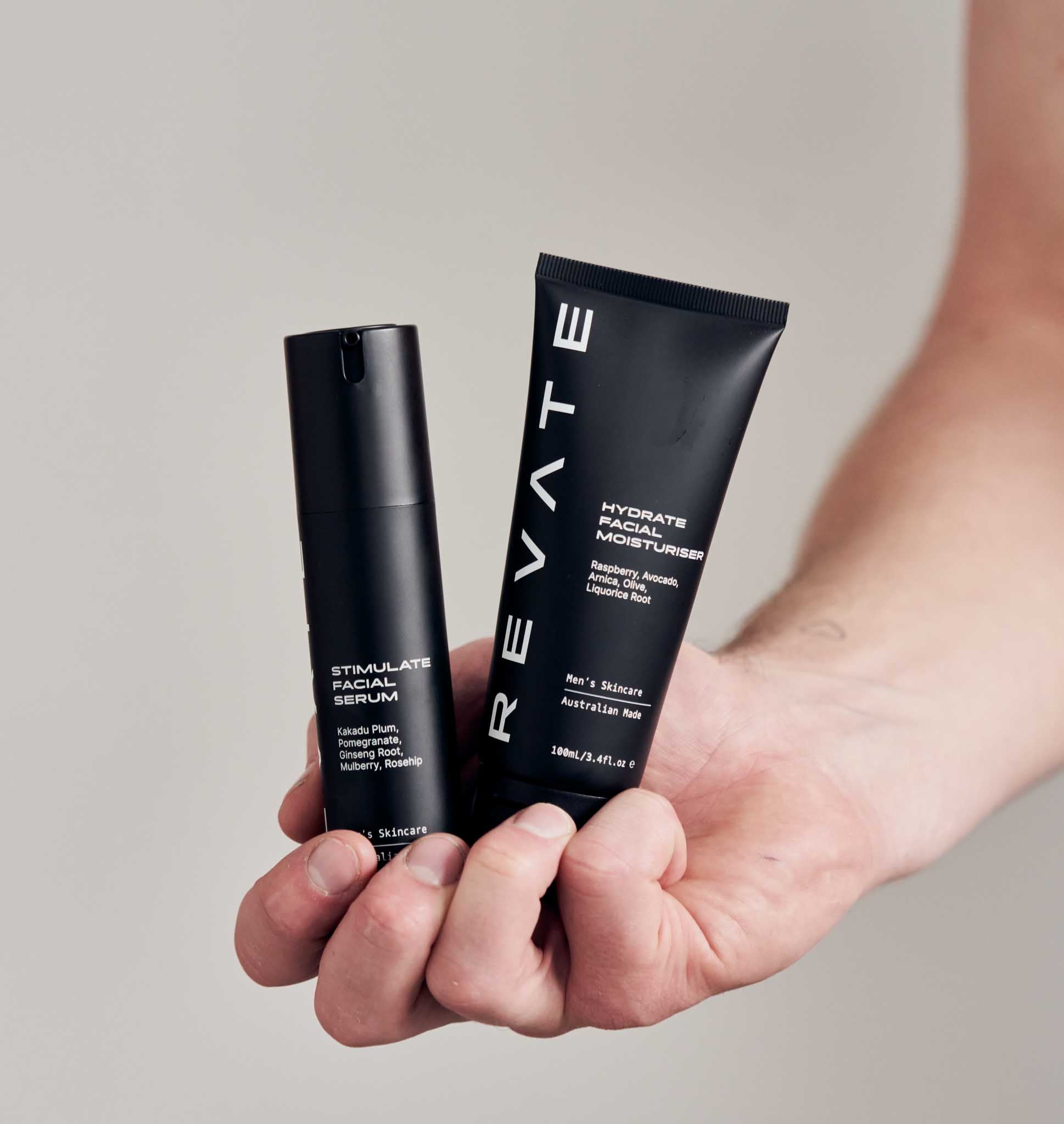 Revate hydrate facial moisturiser and stimulate facial serum in hand