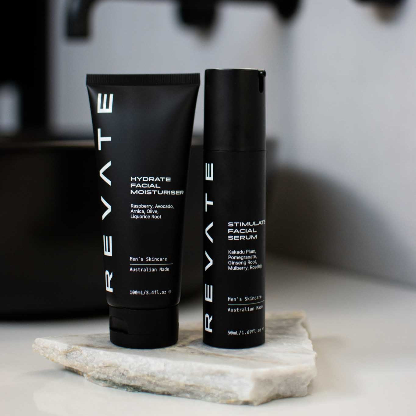 Revate hydrate facial moisturiser and stimulate facial serum on marble in bathroom