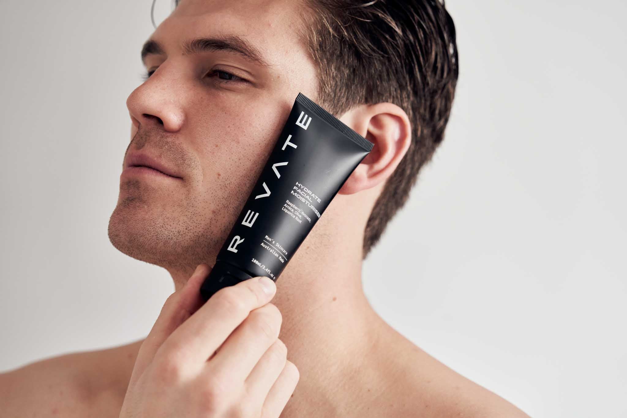 Revate hydrate facial moisturiser held next to face best